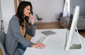 business woman working from home, protected using network penetration testing