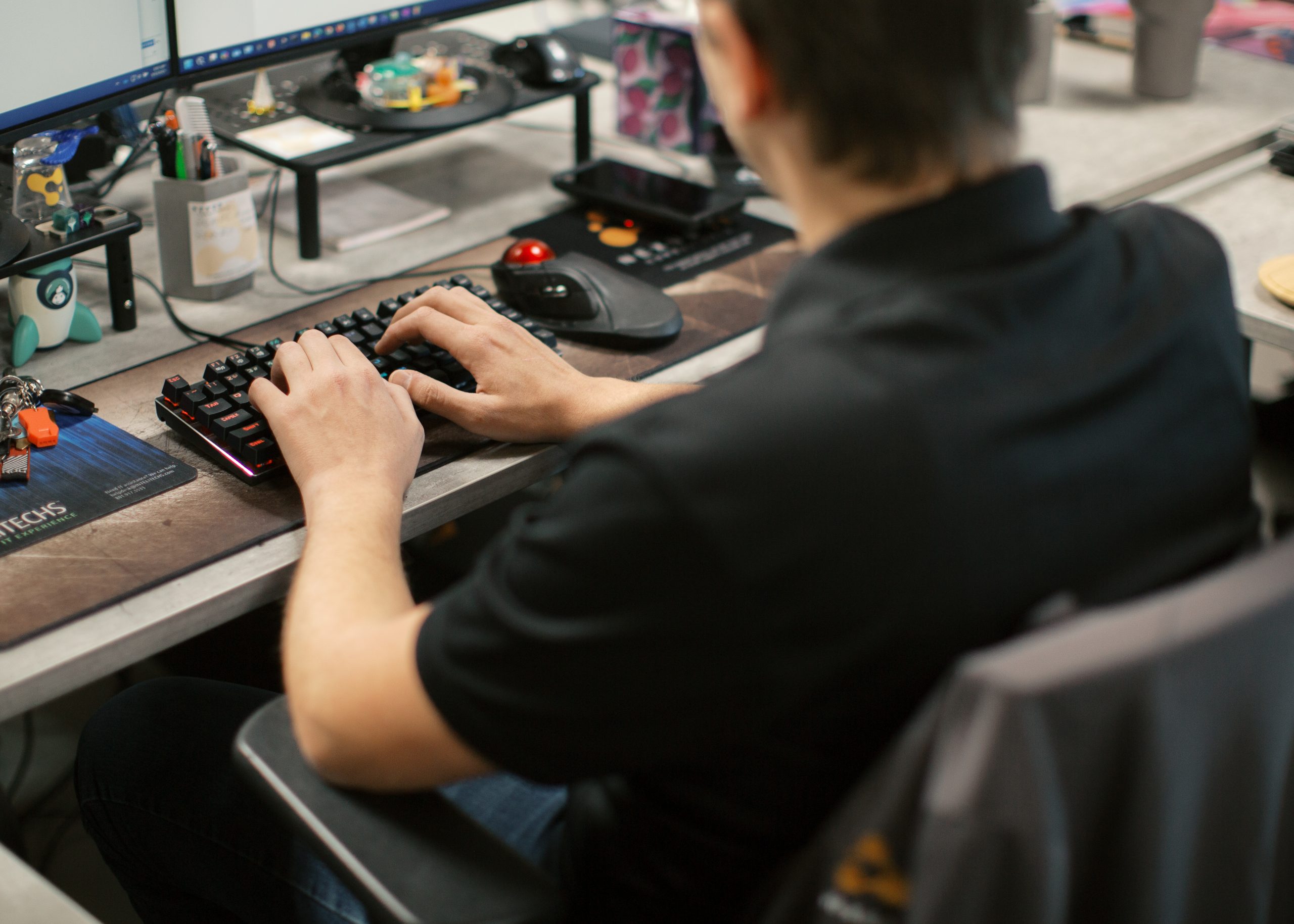 person typing on keyboard
