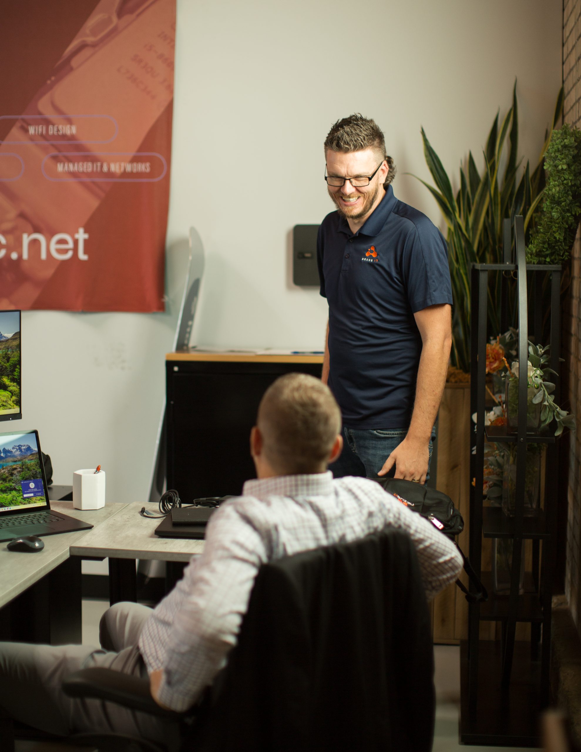 two office workers smiling and chatting